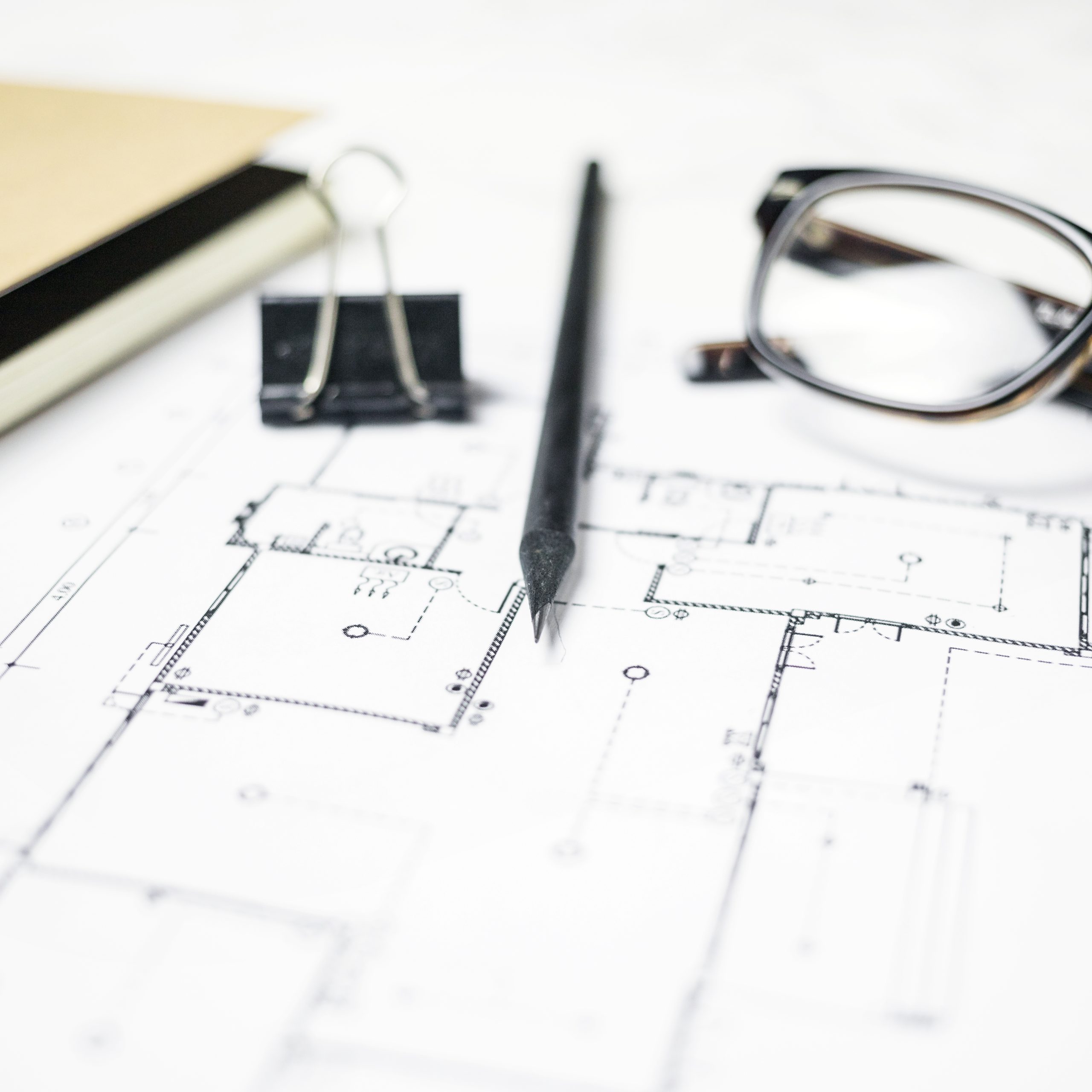 stationery-glasses-lying-blueprint
